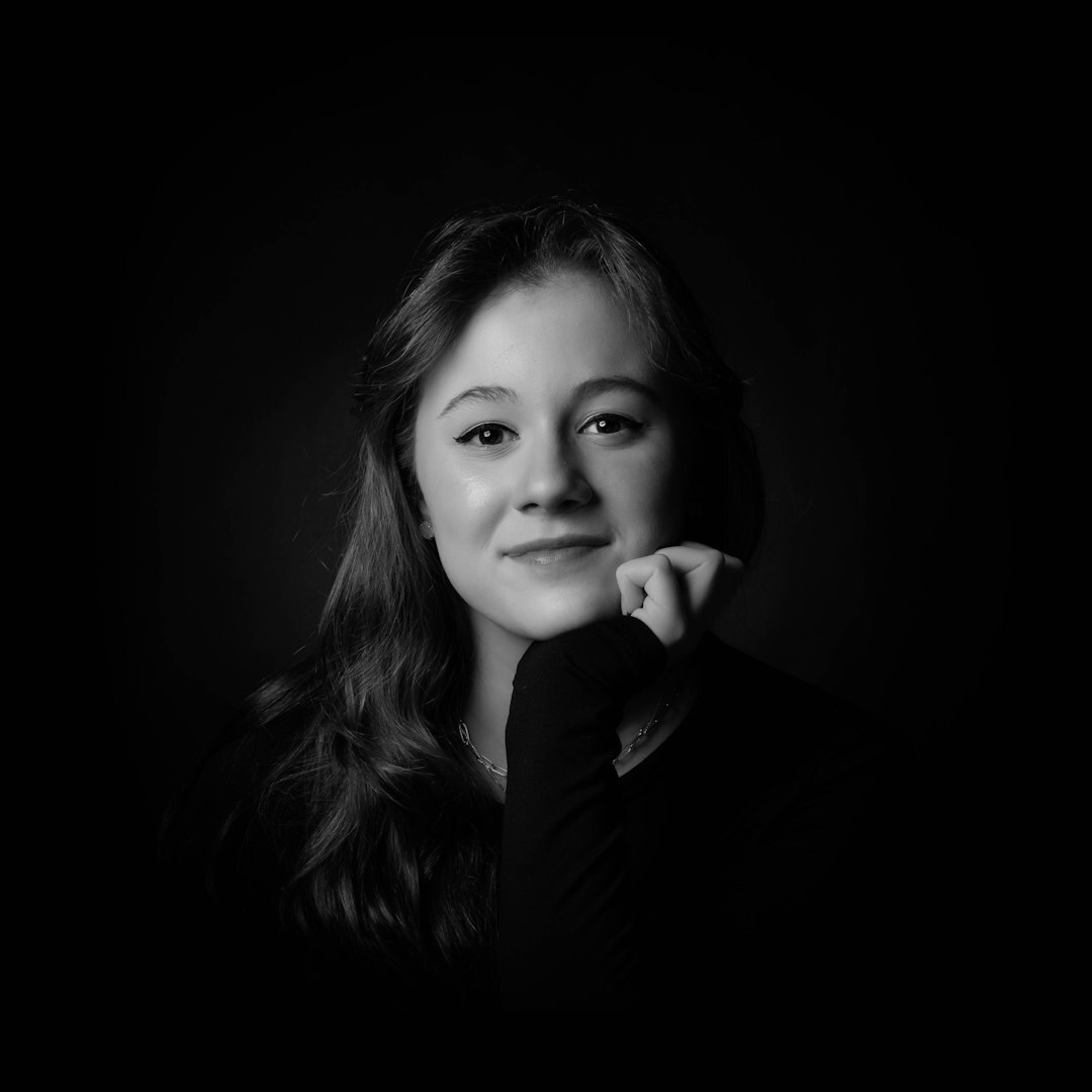 Studio portrait of a woman with short hair smiling