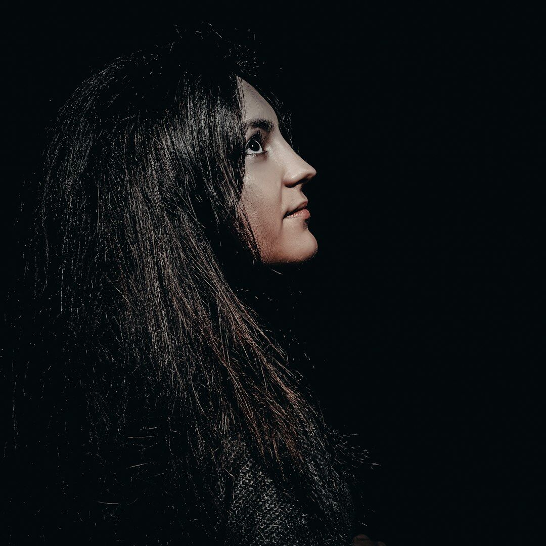 Studio portrait of a young woman with straight hair