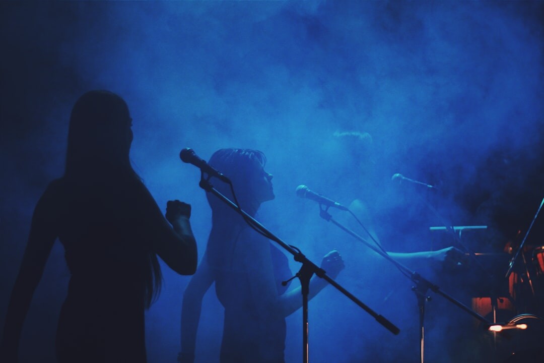 woman singing on stage live